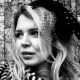 A black and white headshot of Zoe